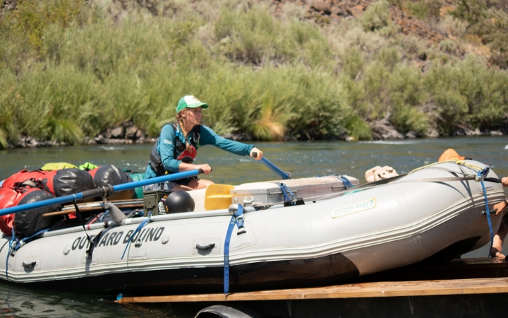 a person launches a raft off a trailer on an outward bound expedition 